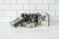 5 bar soaps with black and white swirls on a white surface