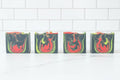 Four soap bars with colorful swirl patterns on a white background